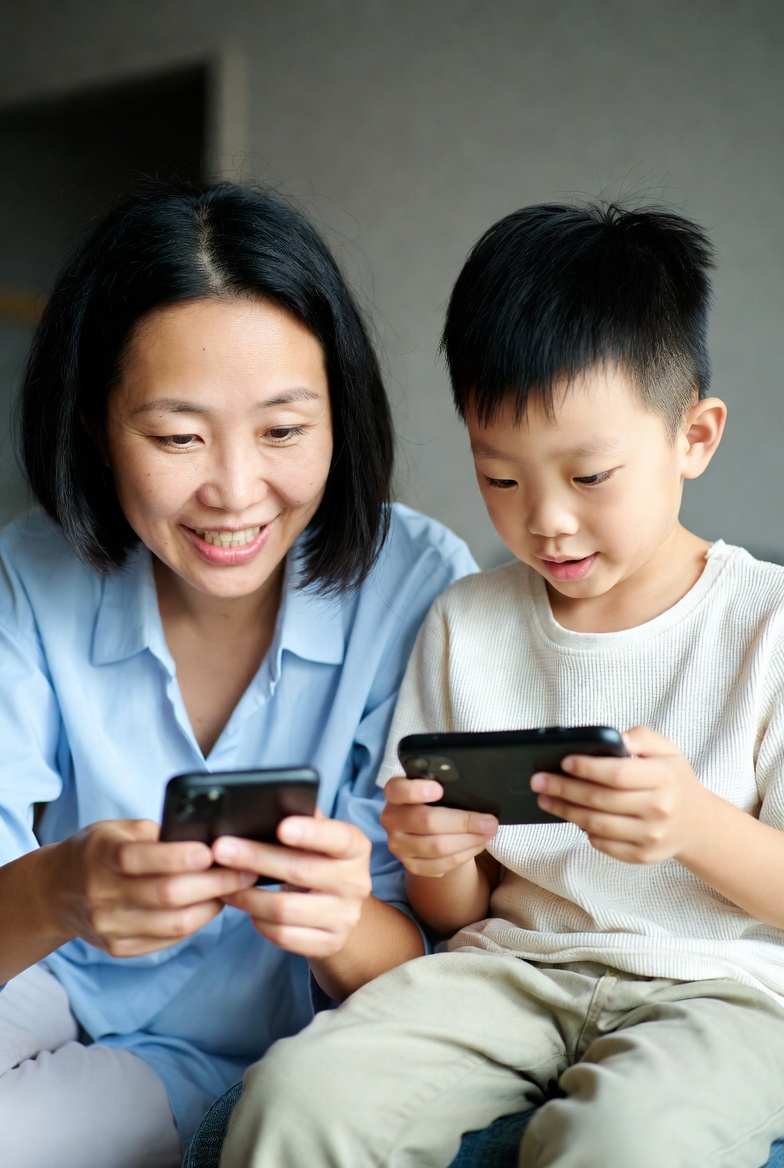 Parent and child playing MentalMather together on their phones